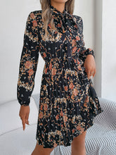 Load image into Gallery viewer, Pleated Printed Tie Neck Long Sleeve Dress